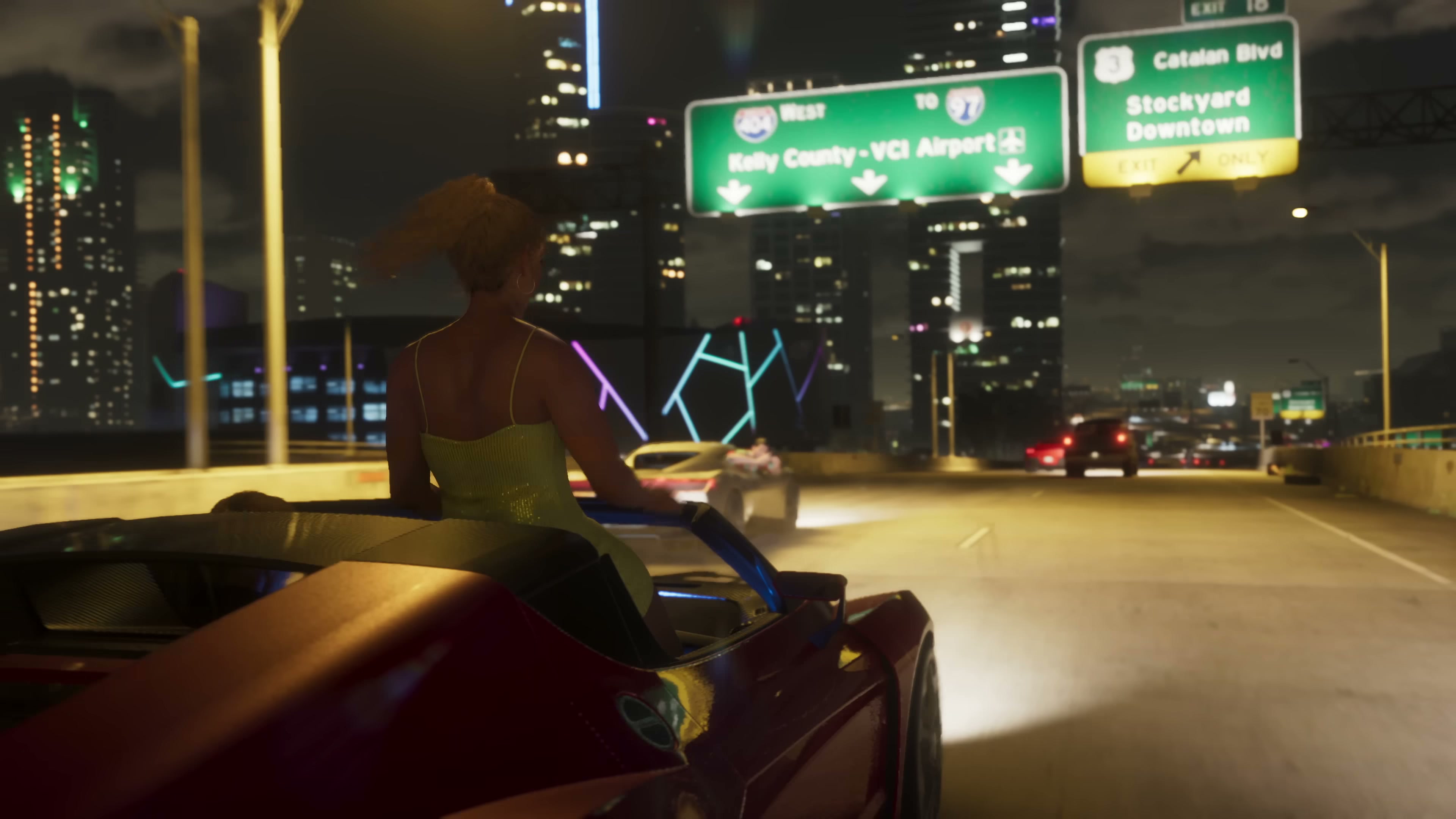 A woman in a yellow dress stands through the sunroof of a red convertible sports car on a Vice City highway at night.