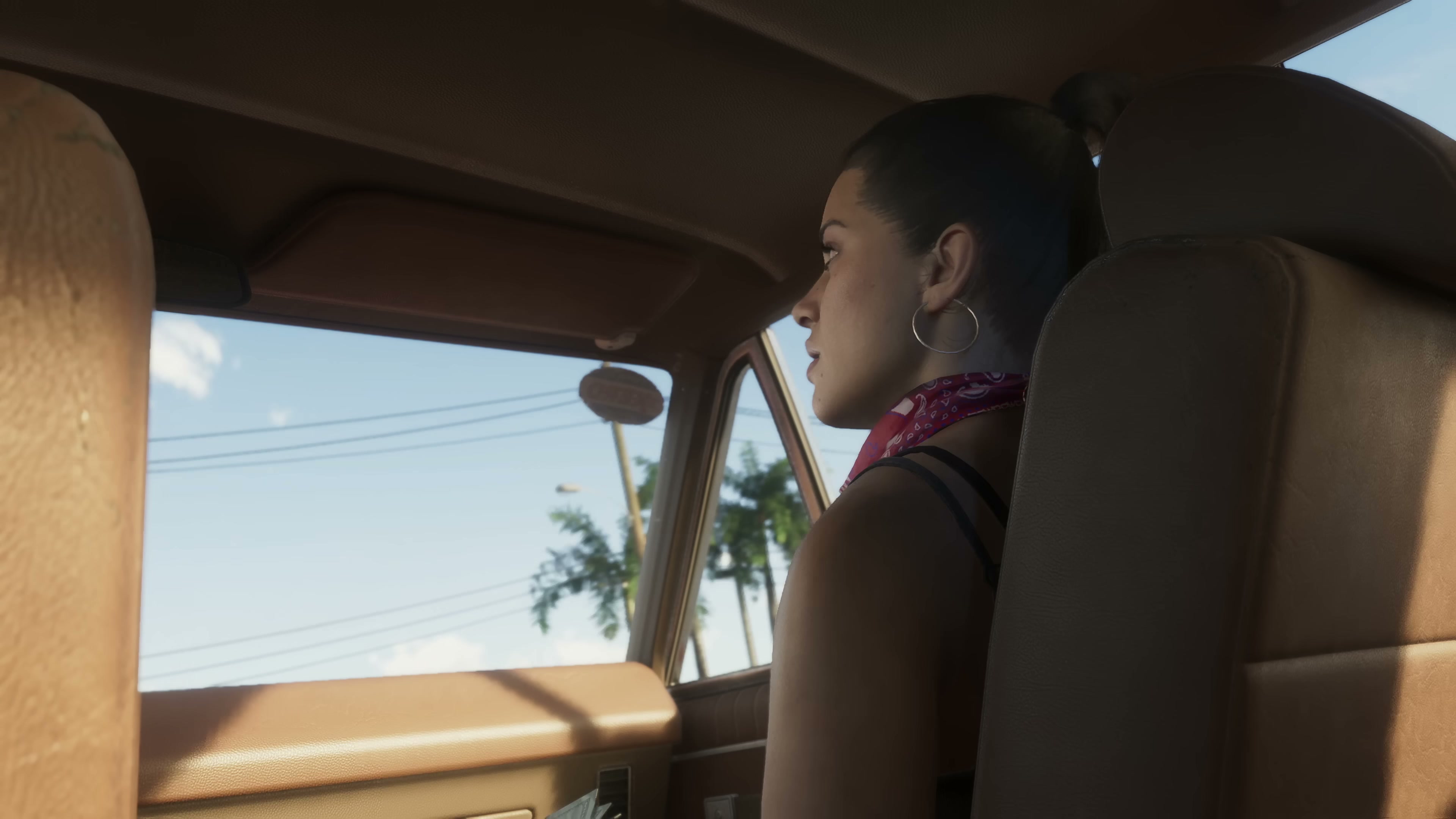 Interior cabin view of Lucia in the passenger seat of a sedan