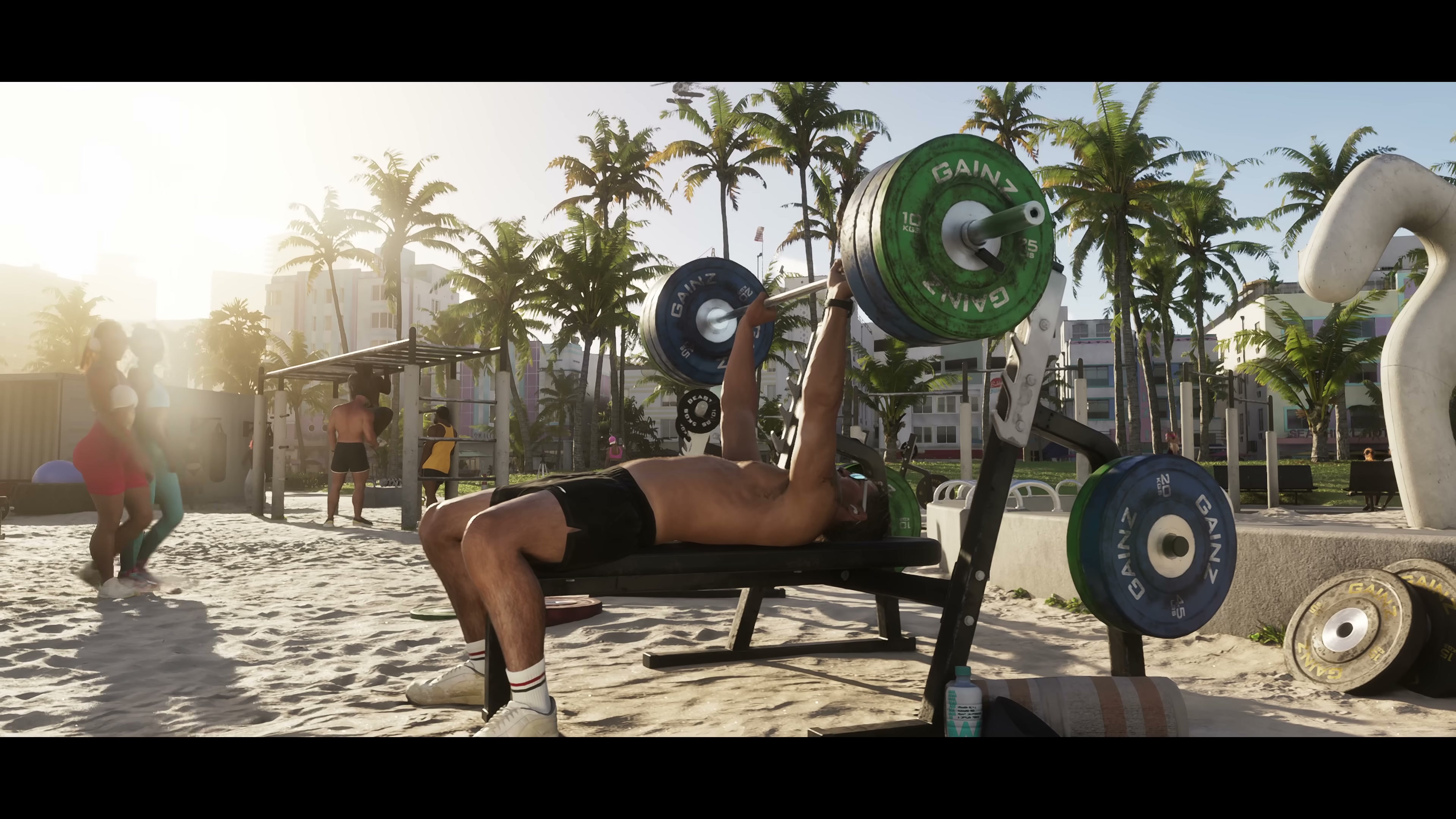 An outdoor 'muscle beach' gym scene with a man bench-pressing under bright sunlight and palm trees.